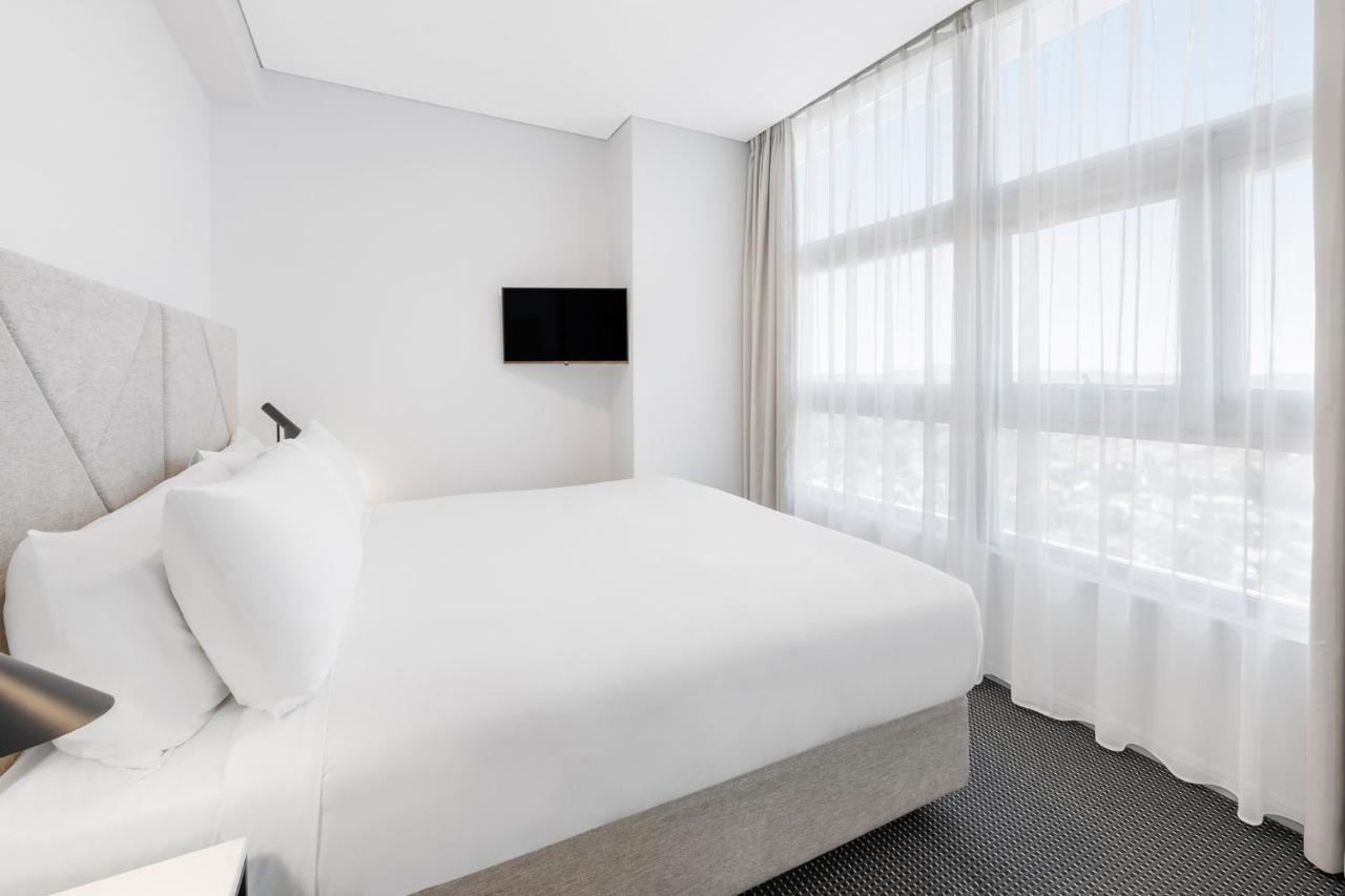 Meriton Suites Zetland Sydney Luaran gambar A bedroom at the hotel