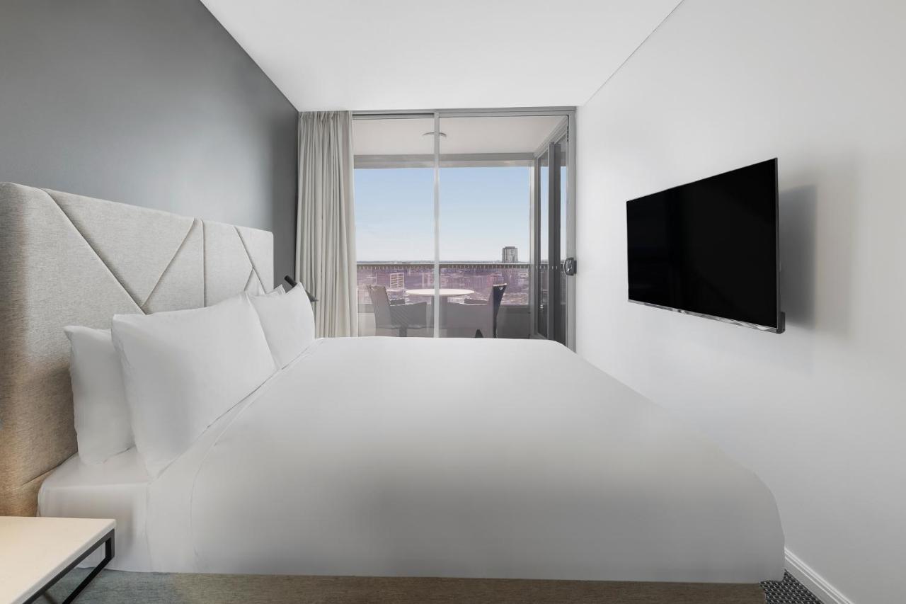 Meriton Suites Zetland Sydney Luaran gambar A bedroom at the hotel